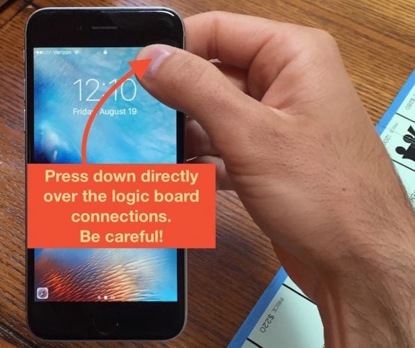 Press down over iPhone logic board connections